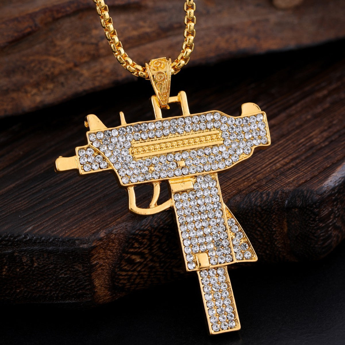 Collana pendente pistola strass