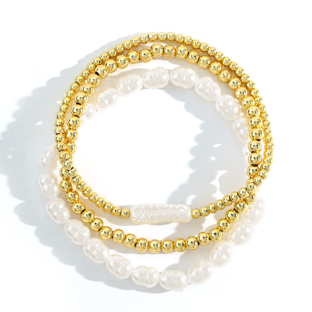 Bracciale perle e sfere dorate