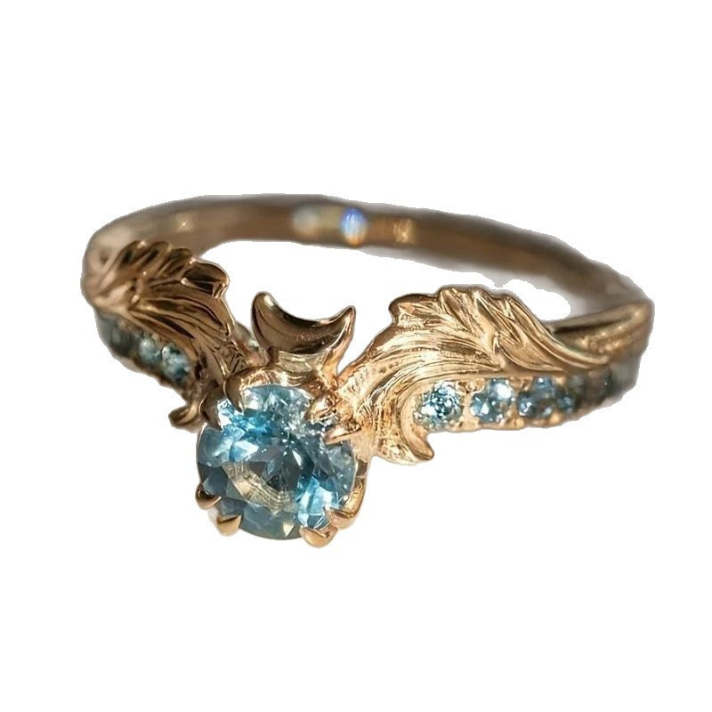 Anello ali zircone