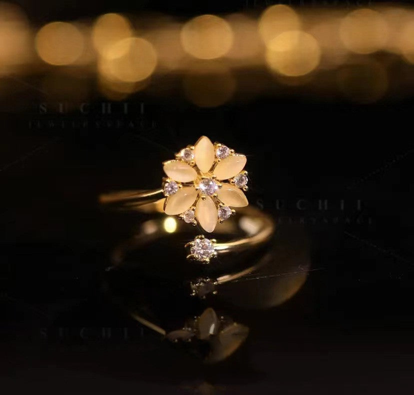 Anello fiore opale rotante