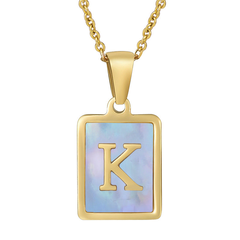 Collana titanio con lettera e conchiglia
