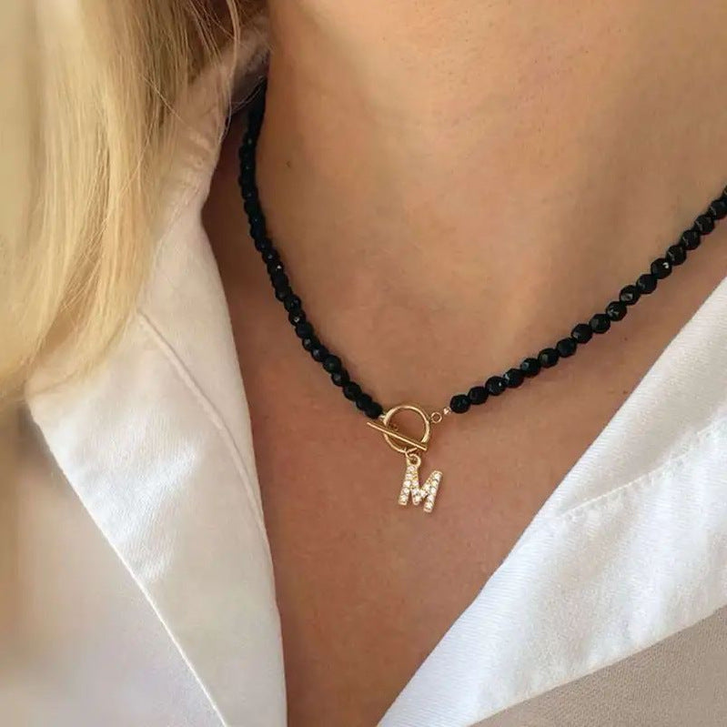 Collana perle con lettere