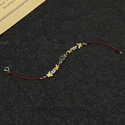 Bracciale farfalla e perle