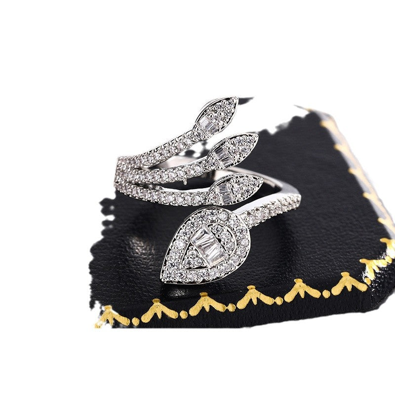 Anello foglie zirconi