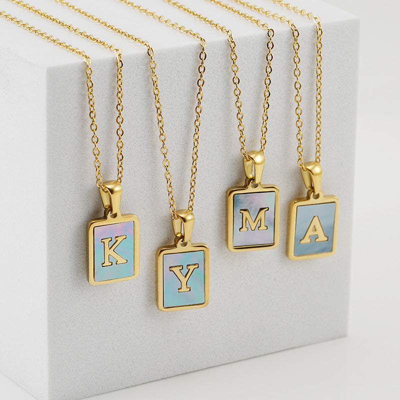 Collana titanio con lettera e conchiglia