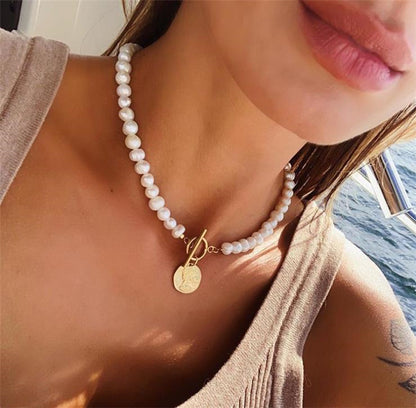 Collana moneta e perle con ciondolo