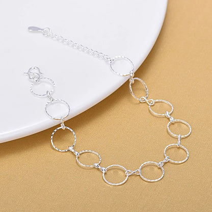Bracciale geometrico rotondo argentato