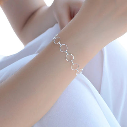 Bracciale geometrico rotondo argentato