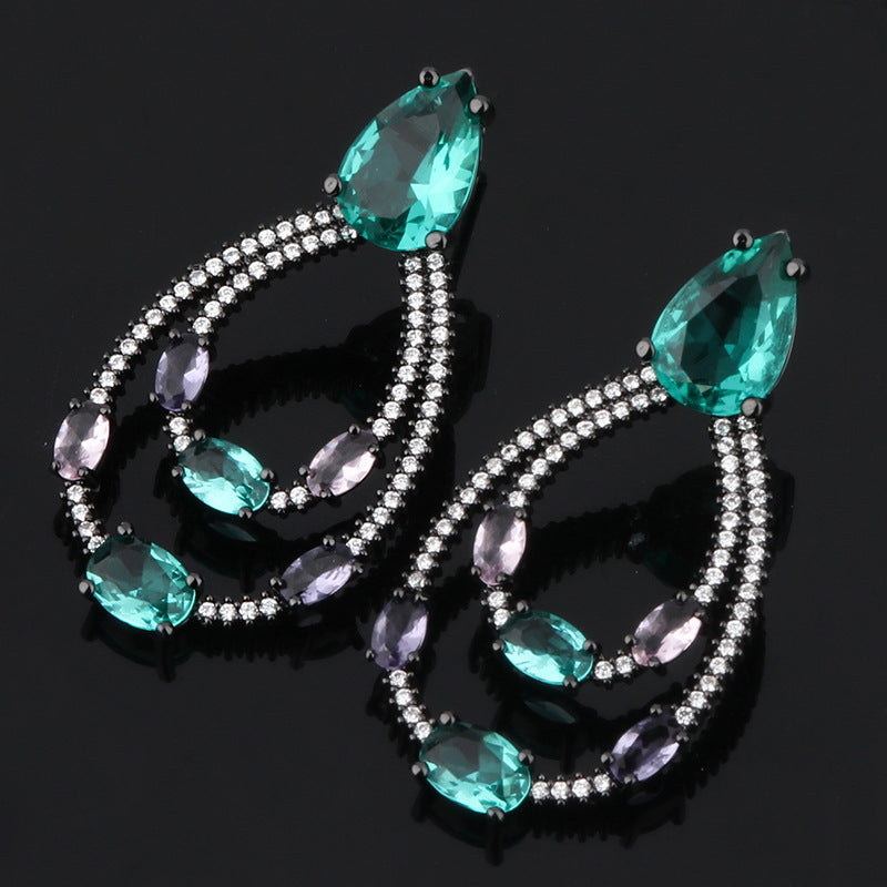 Orecchini goccia verde con zirconi