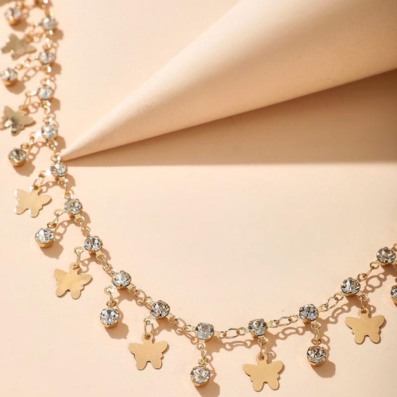 Cavigliera farfalla nappina con strass