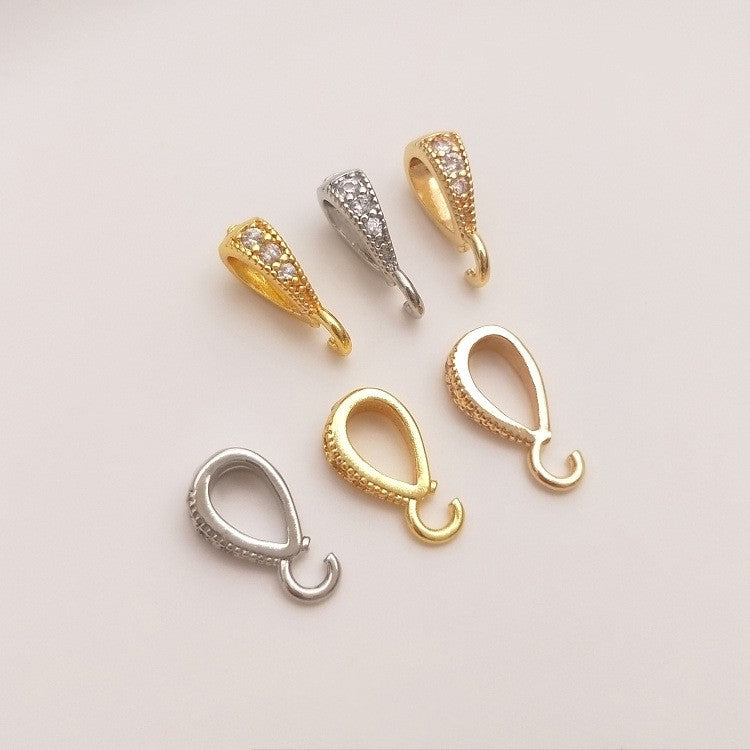 Fibbia ovale dorata con zircone
