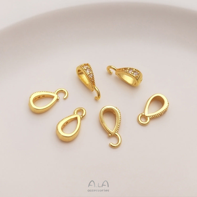 Fibbia ovale dorata con zircone
