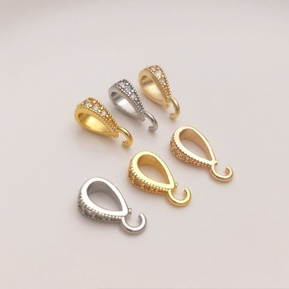 Fibbia ovale dorata con zircone