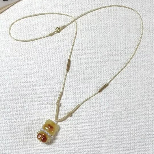 Collana intrecciata orsetto caramello