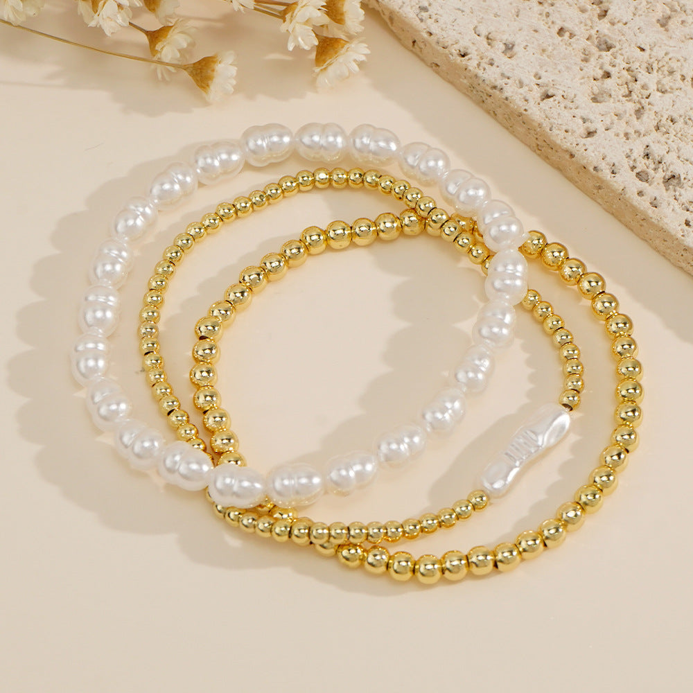 Bracciale perle e sfere dorate