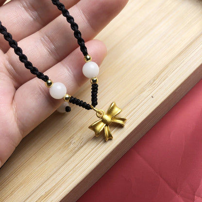 Collana fiocco intrecciata oro