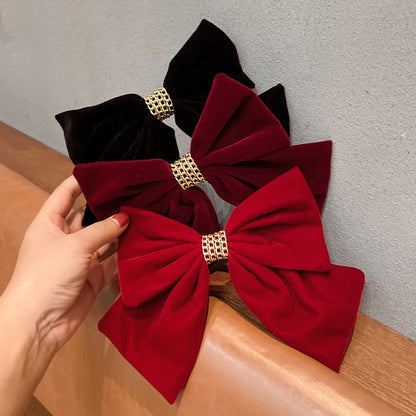 Spillone fiocco velluto rosso