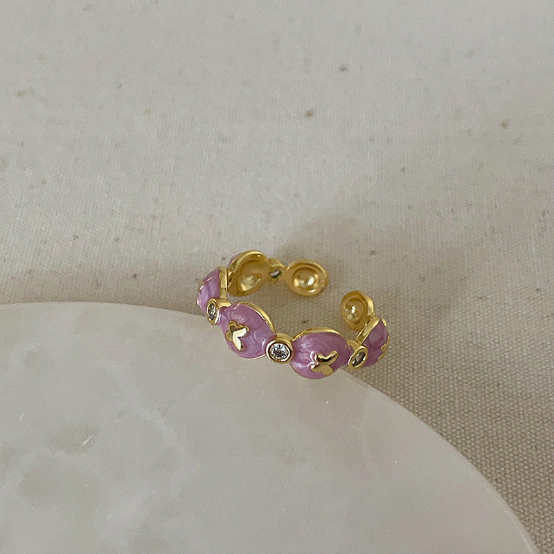 Anello farfalla e fiore viola
