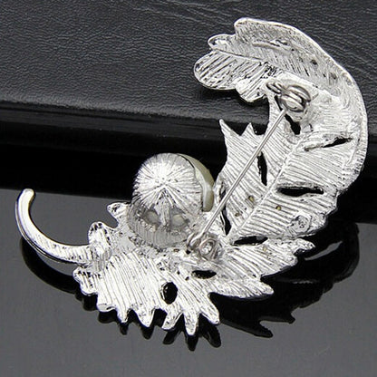 Spilla piuma con strass