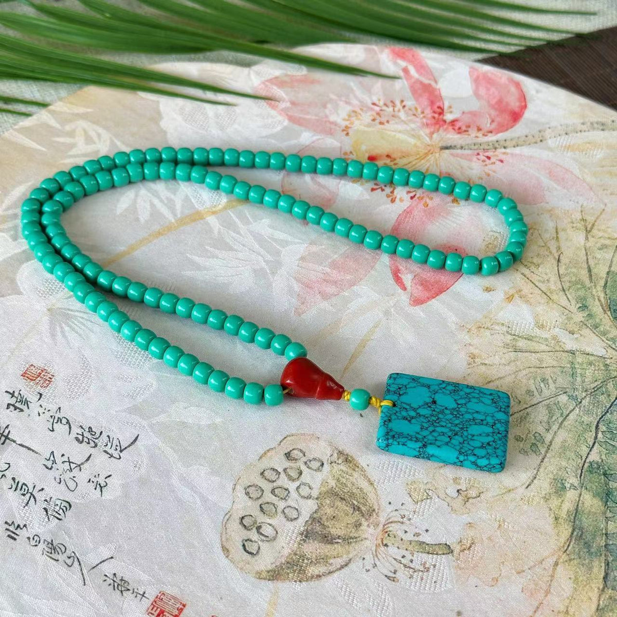 Collana turchese con ciondolo portafortuna