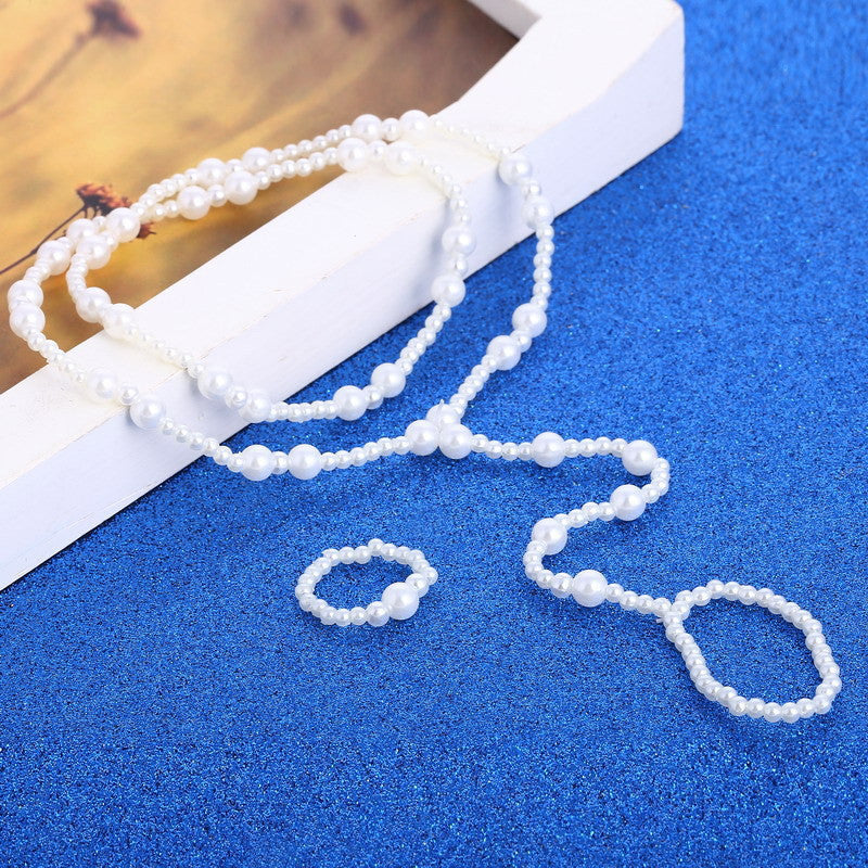 Set cavigliera e anello con perle