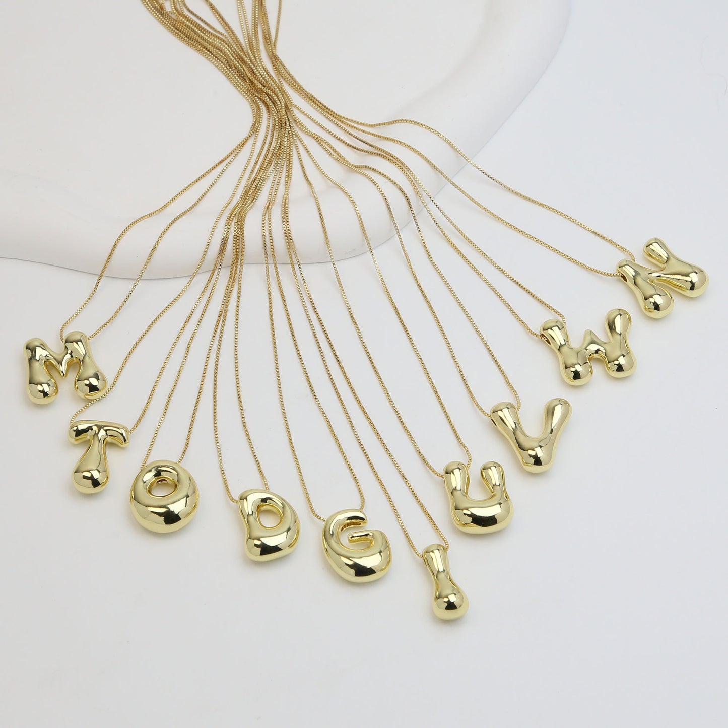 Collana lettera in ottone