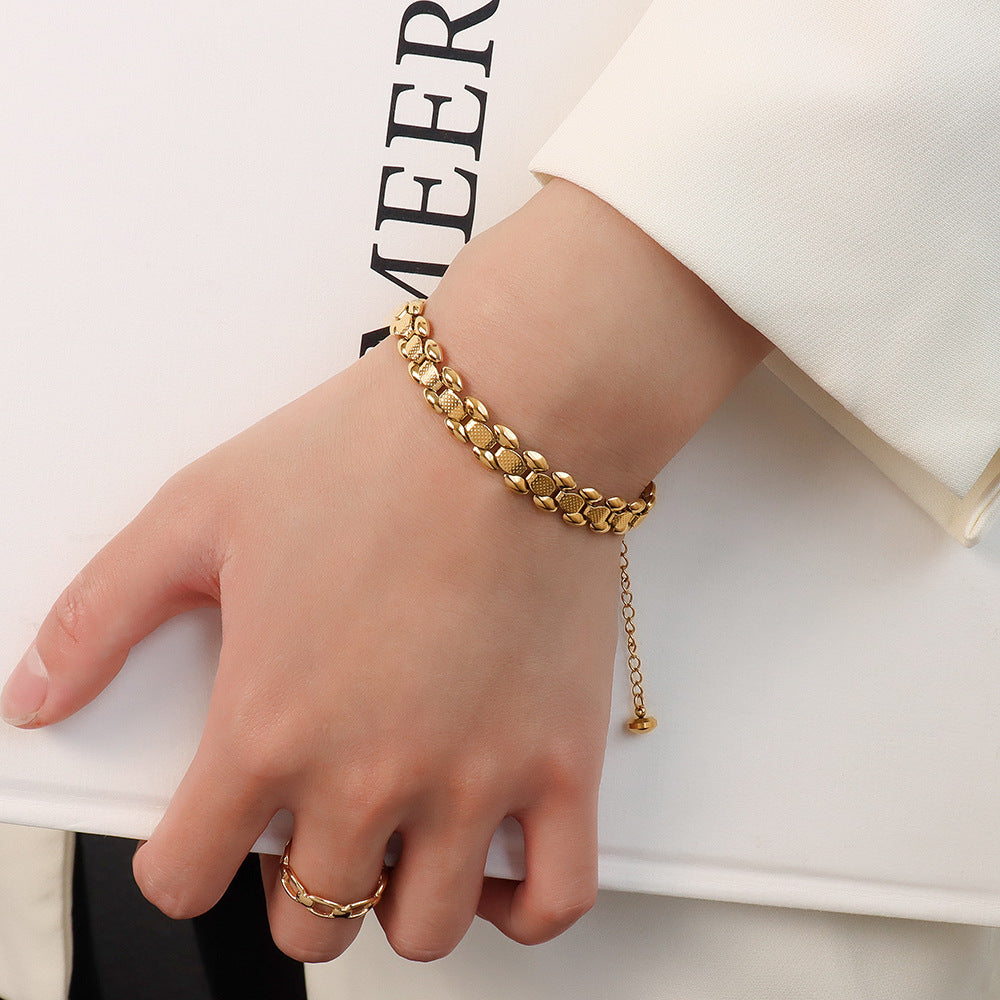 Bracciale titanio oro 18K