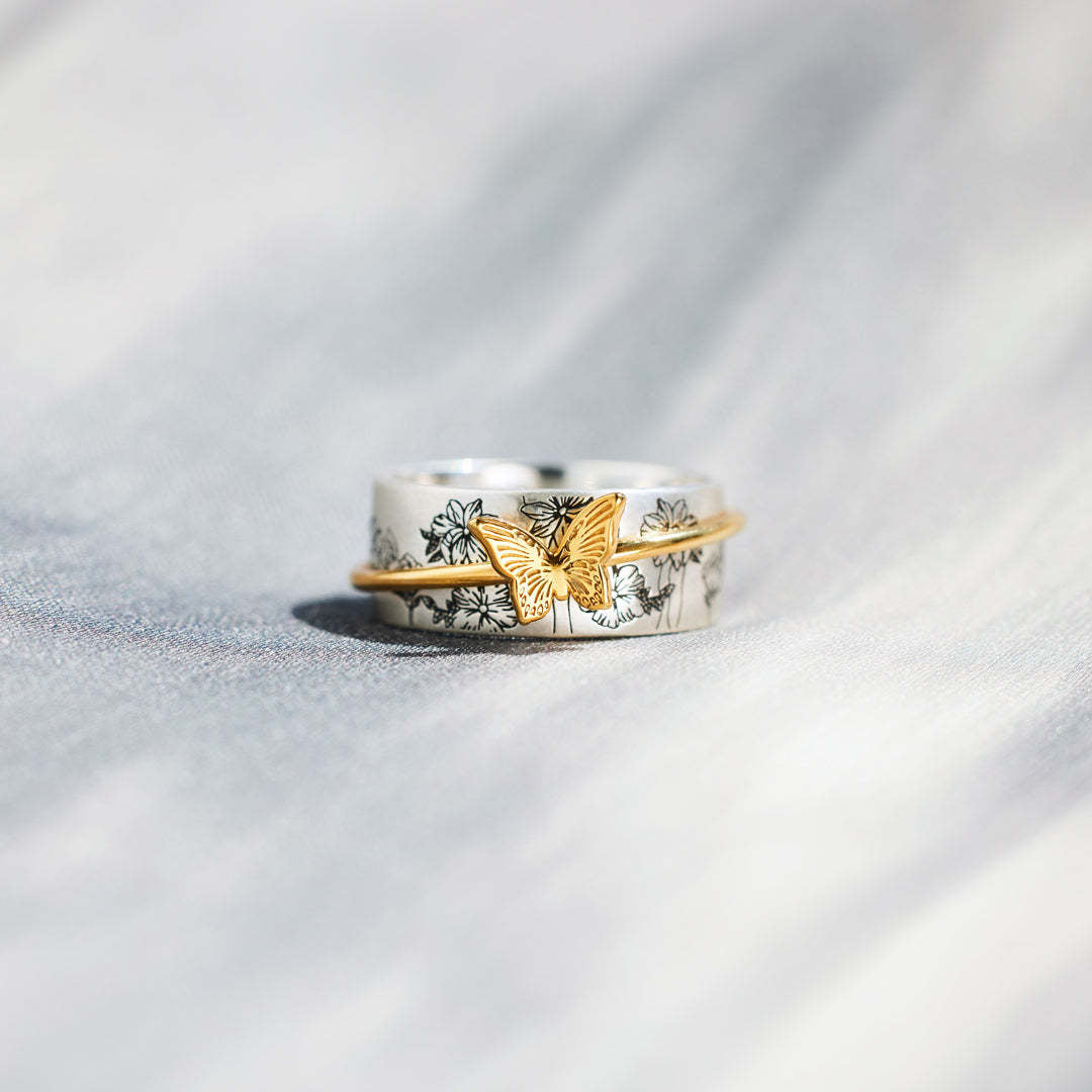 Anello farfalla rotante
