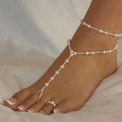 Set cavigliera e anello con perle