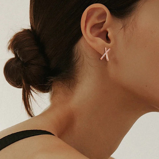 Orecchini croce geometrica zircone oro rosa