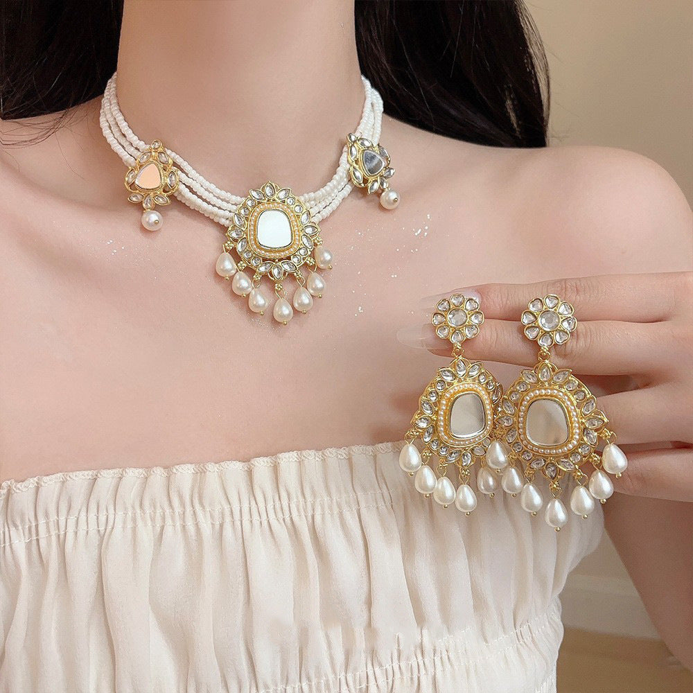 Set collana orecchini fiore con nappa