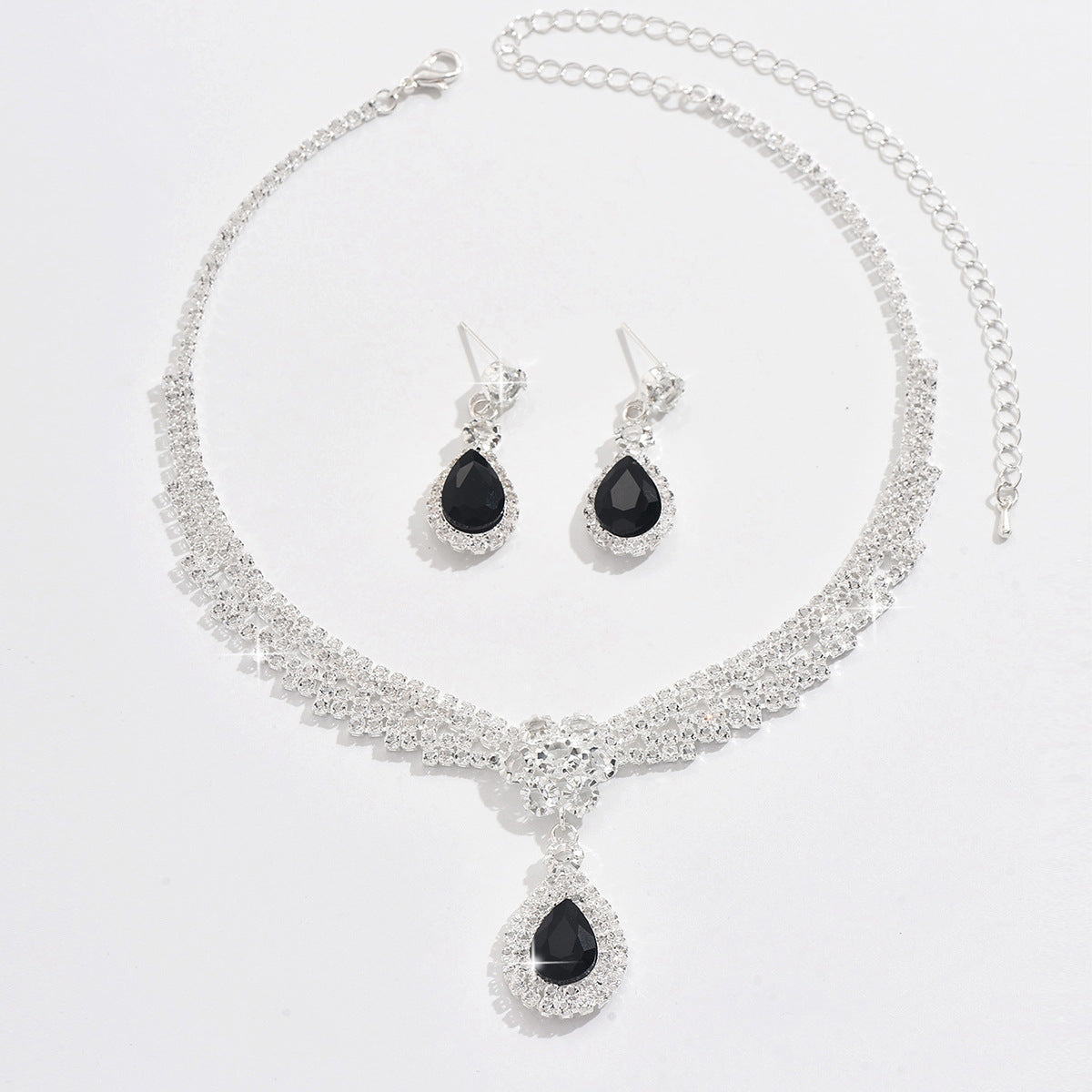 Set collana e orecchini goccia e fiore con cristalli