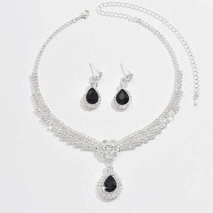 Set collana e orecchini goccia e fiore con cristalli