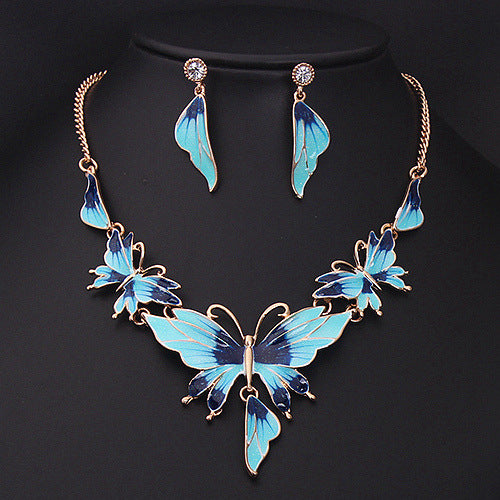 Set collana e orecchini farfalla olio