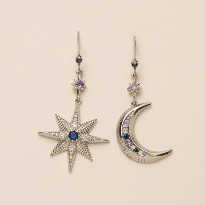 Orecchini stella e luna asimmetrici con zirconi