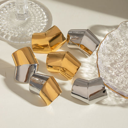 Orecchini geometrici oro acciaio