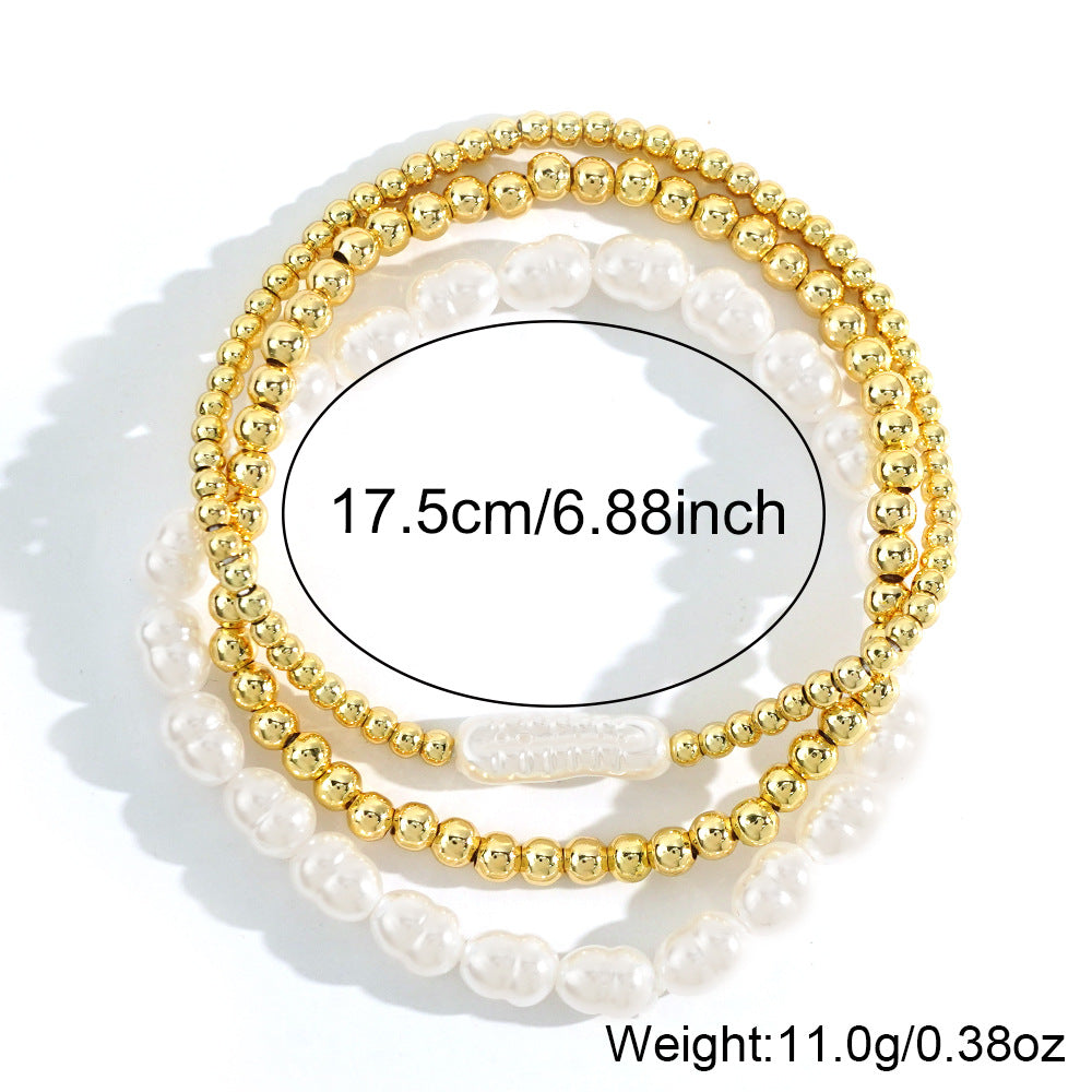 Bracciale perle e sfere dorate