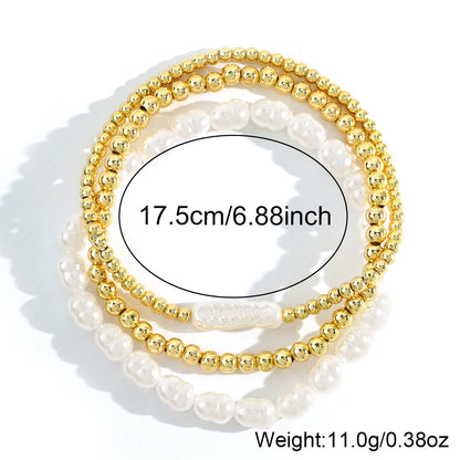 Bracciale perle e sfere dorate