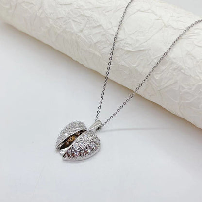 Collana acciaio titanio cuore farfalla girasole