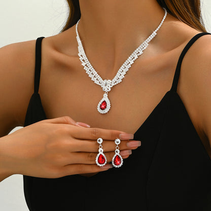 Set collana e orecchini goccia e fiore con cristalli