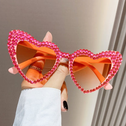 Occhiali da sole cat-eye da donna con cuore