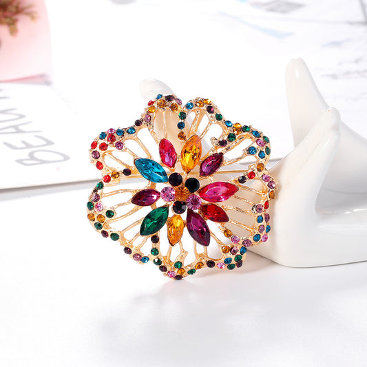 Spilla fiore strass cava