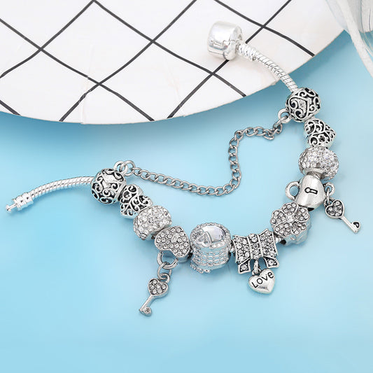 Bracciale ciondoli cuore e chiave