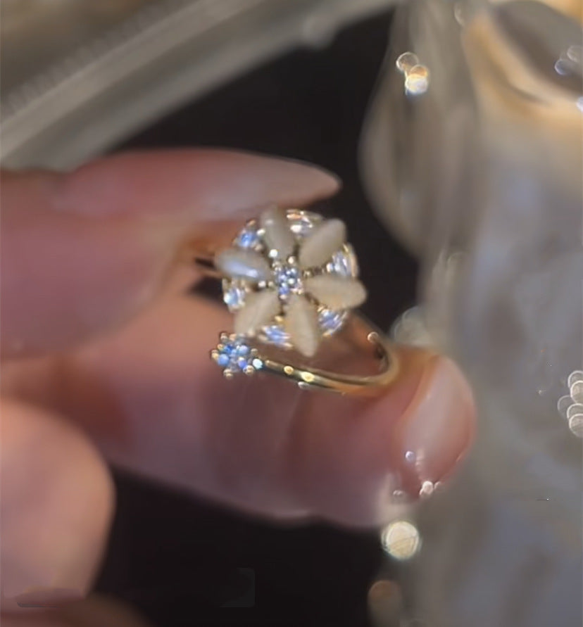 Anello fiore opale rotante