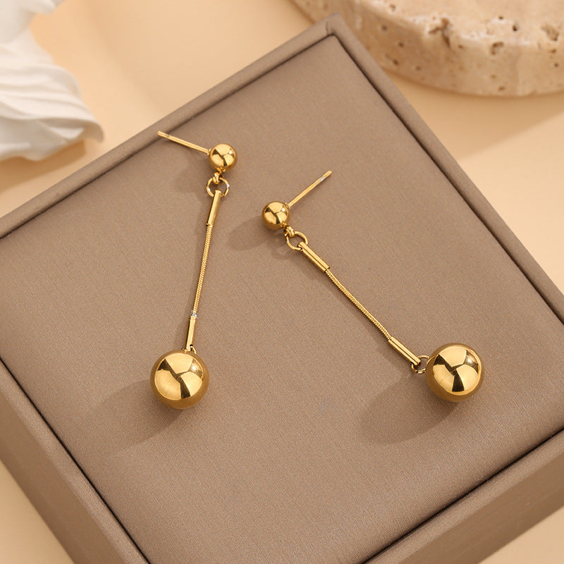 Collana sfere dorate con nappa