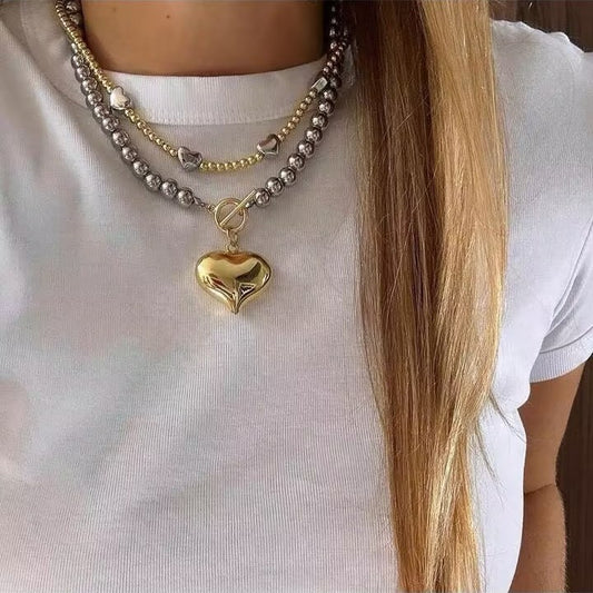 Collana cuore croce nappa