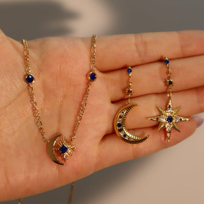 Orecchini stella e luna asimmetrici con zirconi