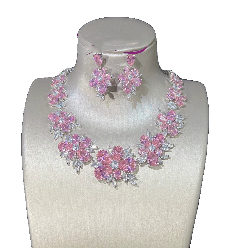 Set gioielli fiore con diamanti