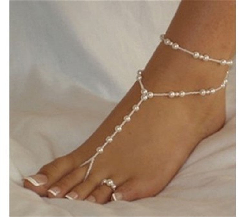 Set cavigliera e anello con perle