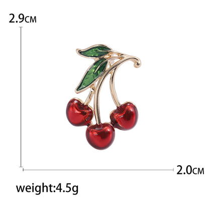 Spilla ciliegia rossa gocciolante